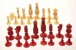 Early 20th century European bone/ivory chess set of natural and red stained form, height of King 9cm