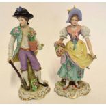 Pair of Continental porcelain figurines on scroll bases, modelled as a gardener and flower seller,
