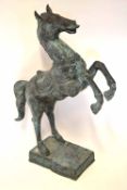 Reproduction tarnished bronze effect model of a rearing horse, 96cm high