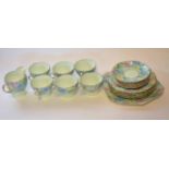 Group of Shelley tea wares in the Melody pattern comprising four cups, saucers, large tea plate,