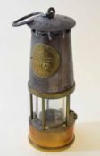 Early 20th century steel and lacquered brass miner's lamp "Protector Lamp & Lighting Co Ltd -