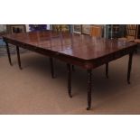 Regency period mahogany extending dining table with moulded frieze and raised on ten ring turned