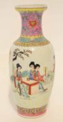 Chinese porcelain baluster vase with polychrome decoration of a family gathered by a table in a