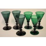 Group of six green glass wine glasses of tapered shape, 14cm high
