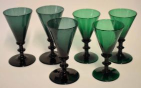 Group of six green glass wine glasses of tapered shape, 14cm high