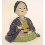 Oriental pottery figure of a lady in brown and green glazes, 16cm high