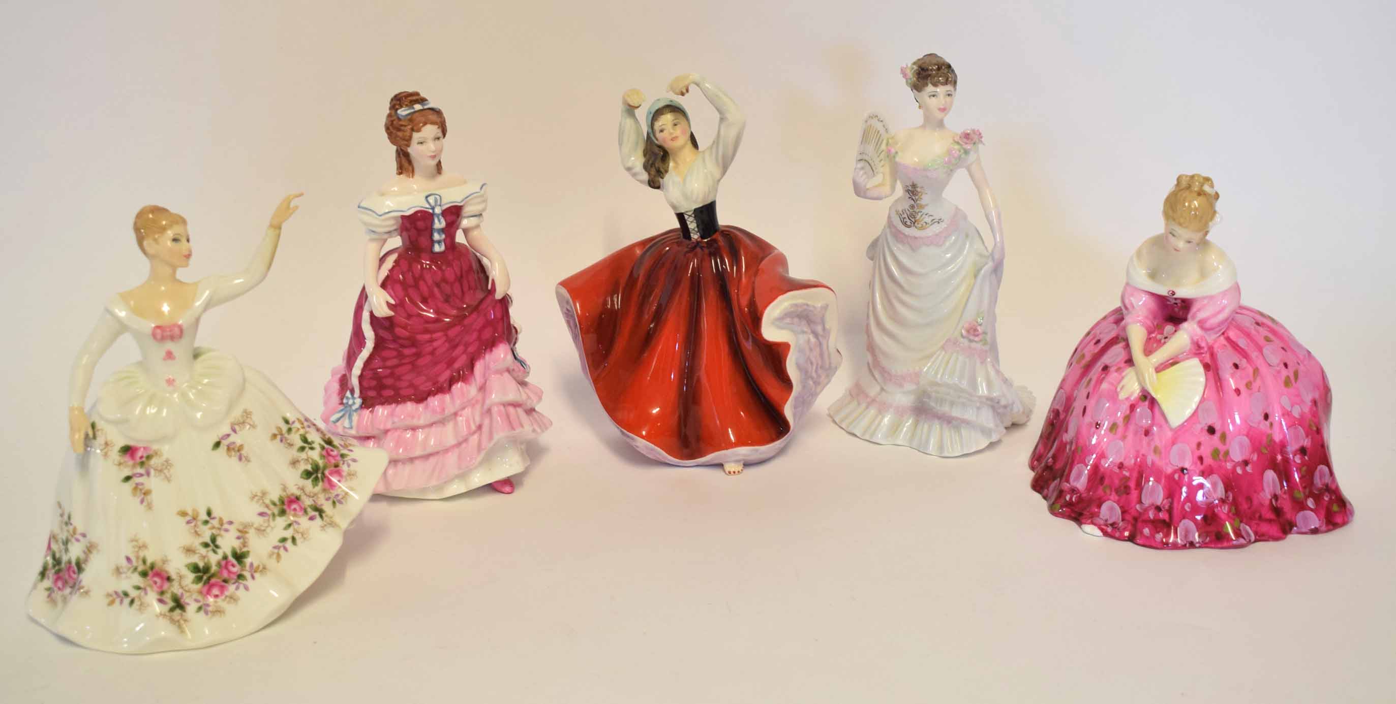 Group of five Royal Doulton figurines including Victoria