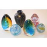 Group of five paperweights and a glass vase modelled in various colours, one paperweight stamped "