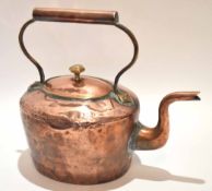 19th century copper kettle of typical oval form with overhead handle and pull off cover, height 31cm