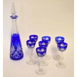 Glass decanter and stopper of slender tapering shape and blue ground, together with seven cut