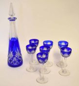 Glass decanter and stopper of slender tapering shape and blue ground, together with seven cut