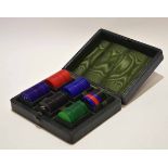 Early 20th century dark green morocco covered case containing a fitted set of stained bone gaming