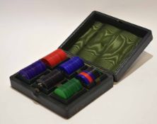 Early 20th century dark green morocco covered case containing a fitted set of stained bone gaming