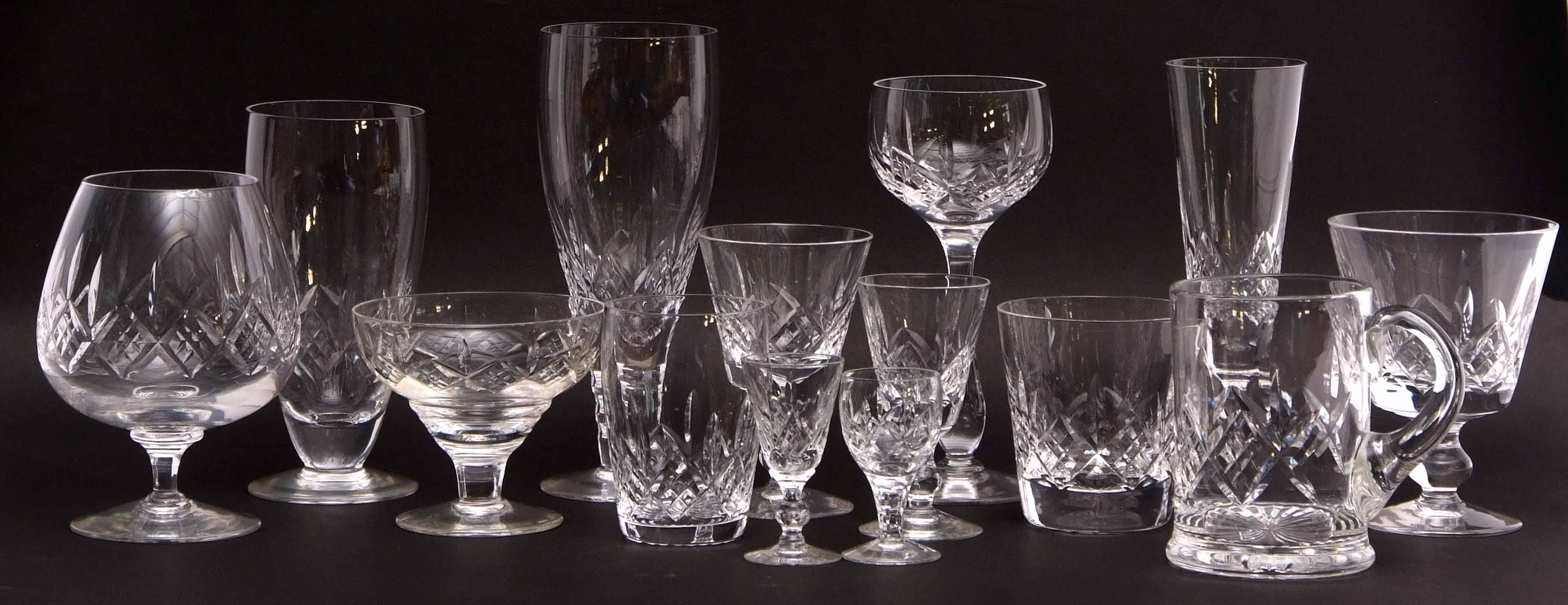 Extensive collection of glass wares including dessert bowls, wine glasses, shot glasses and