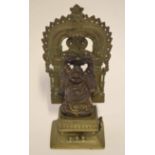 Bronzed metal figure of Buddha on a separate base, Middle Eastern in style, with a detachable