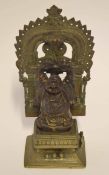 Bronzed metal figure of Buddha on a separate base, Middle Eastern in style, with a detachable