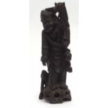 Oriental wooden carving, probably late 19th century, of an immortal or elderly figure holding a