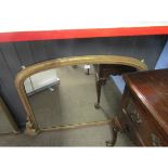 Victorian gilded overmantel mirror of arched form, applied on either side with scroll mounts,