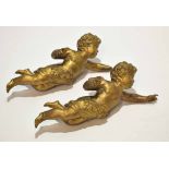 Two cast gilt metal electric light weights, each modelled in the form of a cherub (one a/f),