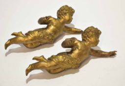 Two cast gilt metal electric light weights, each modelled in the form of a cherub (one a/f),