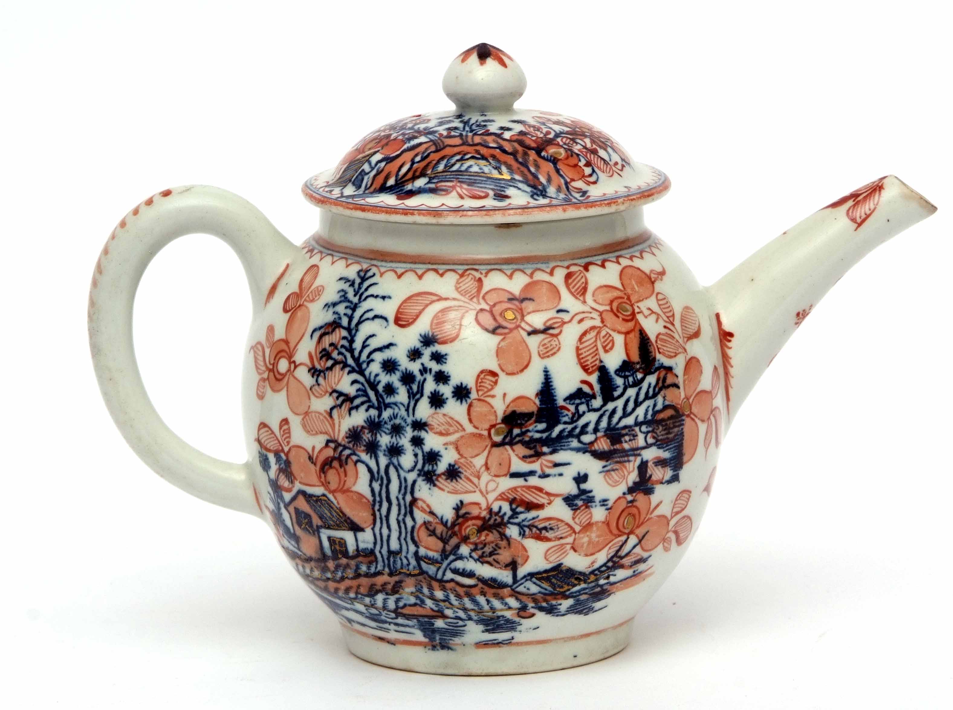 Lowestoft tea pot, circa 1780, of typical form, the blue printed tall trees design further decorated