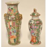 Cantonese vase decorated with panels of Chinese characters and birds and butterflies in a famille