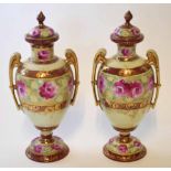 Pair of Continental vases and covers with a pink floral design (2)