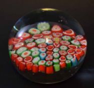 Large glass paperweight with a swirl design, the base with a Murano sticker