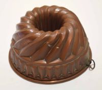 Late 19th century tin lined copper jelly mount of wrythen circular form and with ring suspension, 21