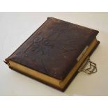 Late 19th century tooled leather covered photograph album with inscription to the front page dated