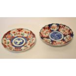 Two Japanese porcelain Imari dishes, both decorated in typical fashion, the largest 22cm diam