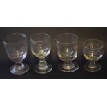 Group of four glass tumblers of various sizes with bucket shaped bowls, largest 13cm high