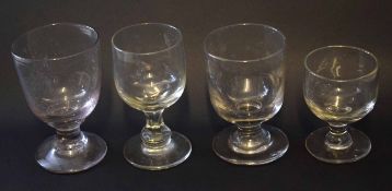 Group of four glass tumblers of various sizes with bucket shaped bowls, largest 13cm high