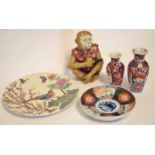 Chinese model of a monkey smoking a pipe, together with a Japanese porcelain Imari dish and