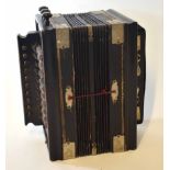 20th century German black finished squeezebox accordion of typical rectangular form and of ten-