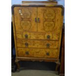 20th century walnut effect tallboy, two doors enclosing cupboard over three frieze drawers on