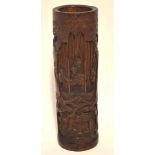 Chinese bamboo carving the front panel decorated with figures above trees and a house, 37cm high