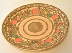 Charlotte Rhead charger decorated in typical tube lined fashion with an oranges design, 32cm diam