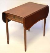 Edwardian Pembroke table, typically fitted at one end with a frieze drawer on tapering supports,