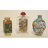 Group of three scent bottles, one glass with stopper with polychrome decoration, a pottery square