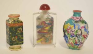 Group of three scent bottles, one glass with stopper with polychrome decoration, a pottery square