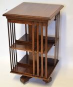 Edwardian mahogany revolving bookcase, two tiers each with four sections, 55cm wide