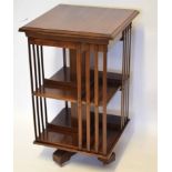 Edwardian mahogany revolving bookcase, two tiers each with four sections, 55cm wide