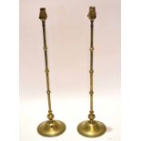 Pair of early 20th century loaded brass electric lamp stands, each with slender and knopped