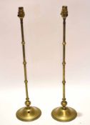 Pair of early 20th century loaded brass electric lamp stands, each with slender and knopped