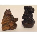 Two carved netsuke, one modelled as a monkey seated on a shell, the other as a group of three rats