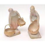 Pair of Austrian Turn pottery figures modelled as girls carrying baskets on a stepped base, the