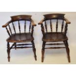 Two smoker's bow chairs, each with spindle backs and solid seats, 19th century