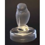 Lalique model of a bird on a circular base, the base signed R Lalique - France, 7cm high