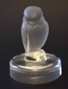 Lalique model of a bird on a circular base, the base signed R Lalique - France, 7cm high